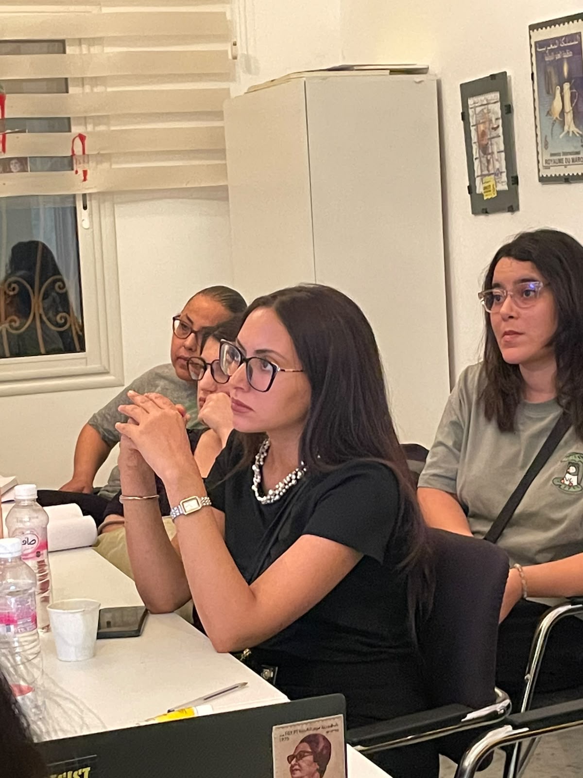 Participants listen closely during a session on AI governance and human rights