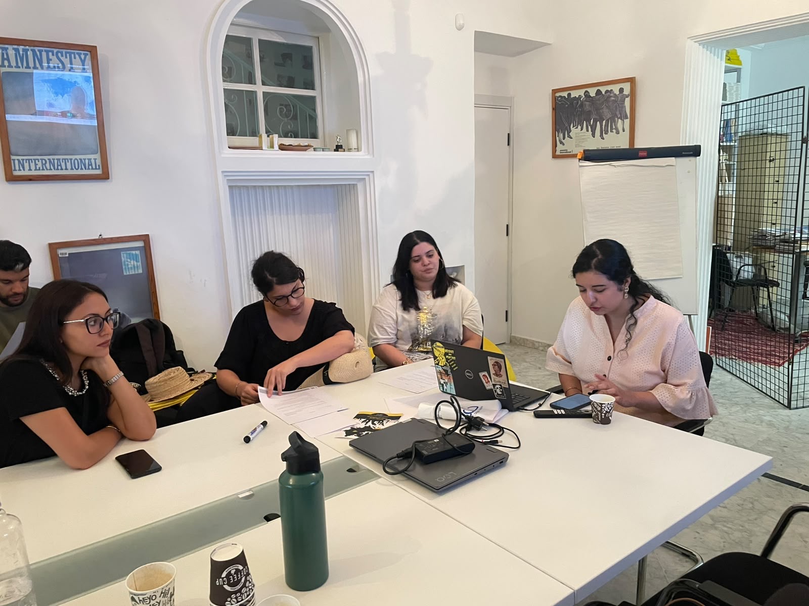 A group compares notes ahead of presenting their findings back to the room